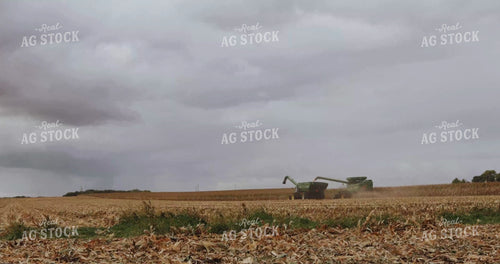 Combine Harvesting Corn and Unloading into Auger Wagon 3918