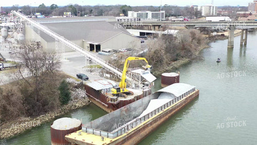 Aerial of Unloading Dry Fertilizer off of River Barge 79204