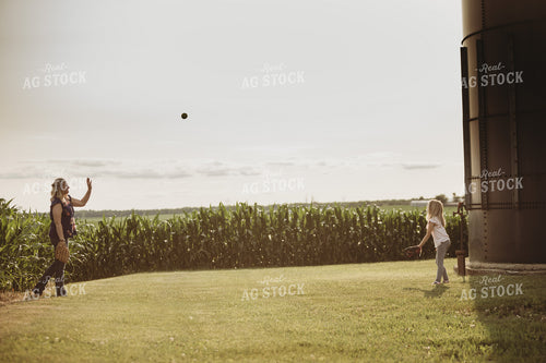 Farm Family Playing Catch Alongside Corn Field 4495