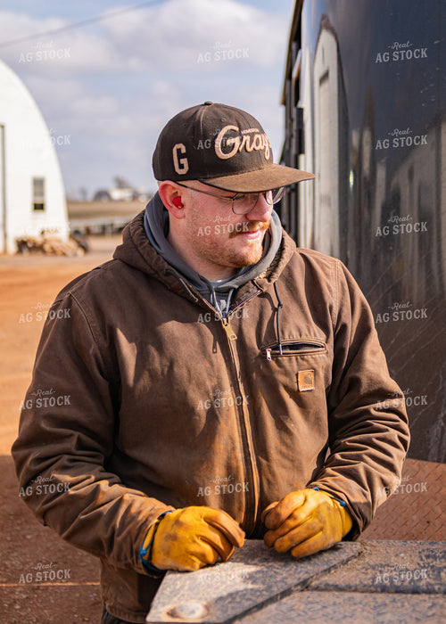 Rancher Leaning on Truck 231090