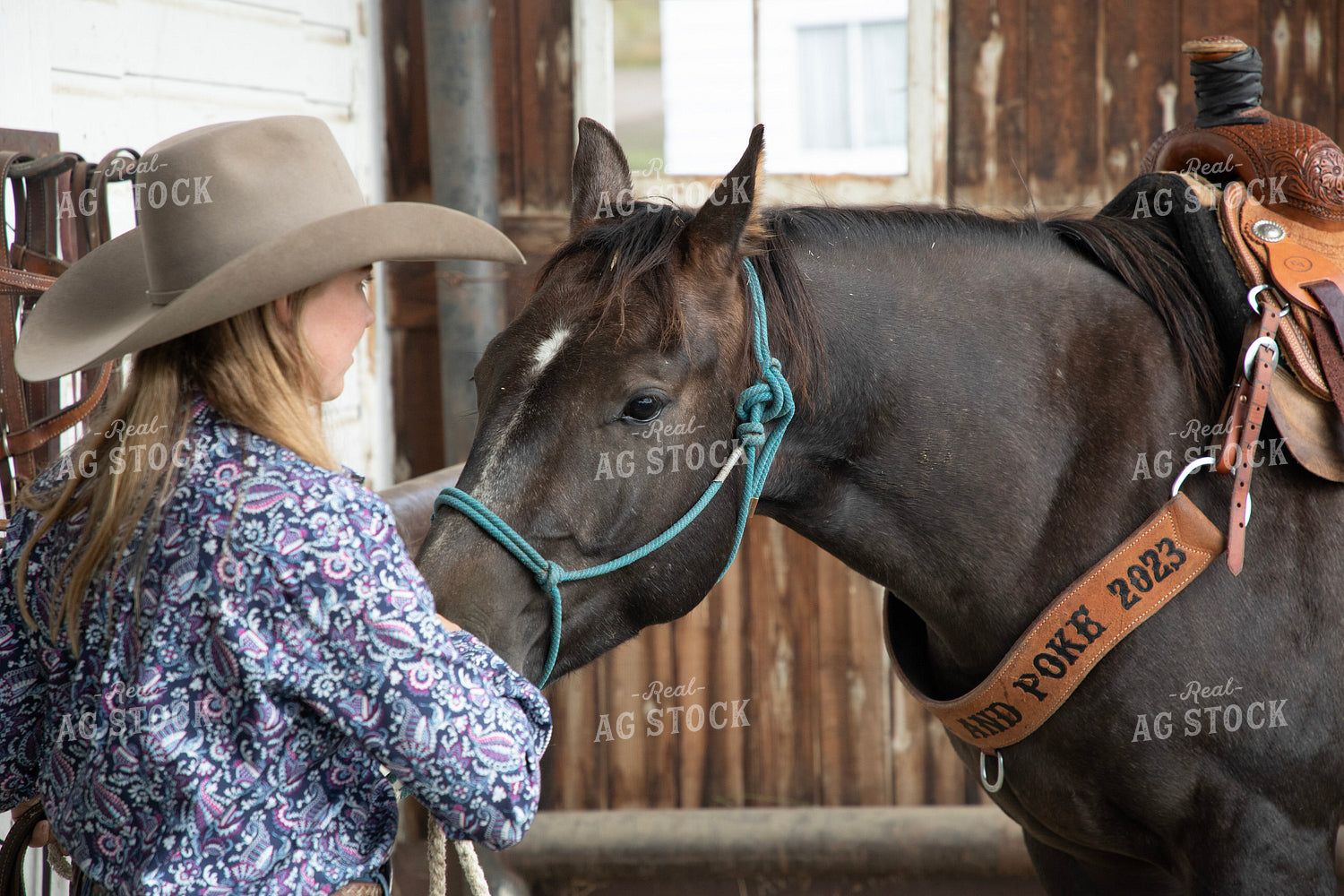 Female Rancher Tacking Horse 117107
