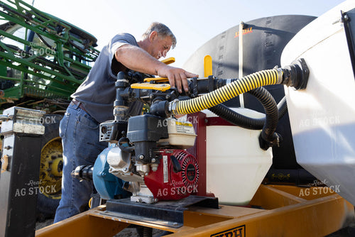 Farmer Loading Sprayer 79672