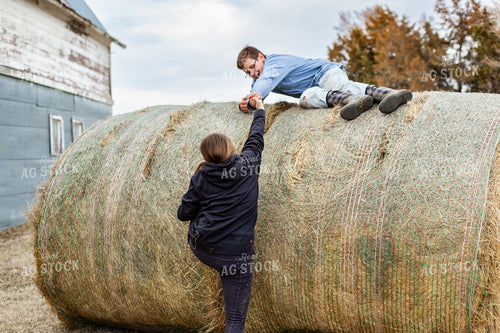 Farm Kids Climbing on Hay Bale 155575