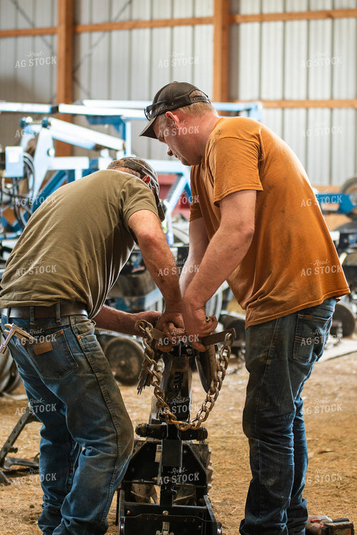 Farmers Working in Shed 50269
