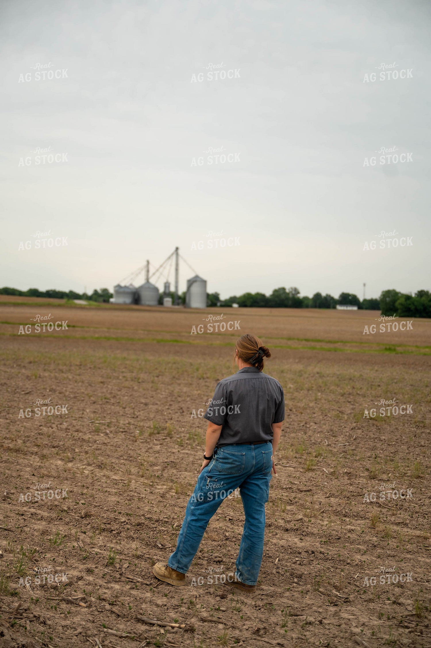 Female Farmer Walking in Field 115730
