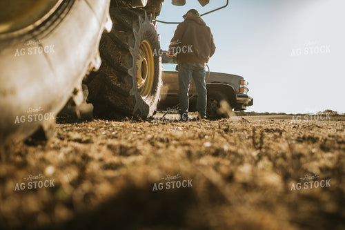 Farmer Using Air Hose to Clean Combine During Soybean Harvest 5198