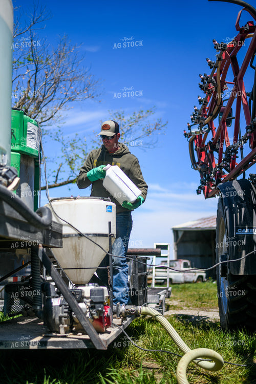 Farmer Mixing Chemicals for Self Propelled Sprayer 191066
