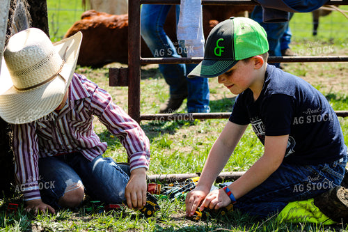 Farm Kids Playing with Toy Tractors 214091