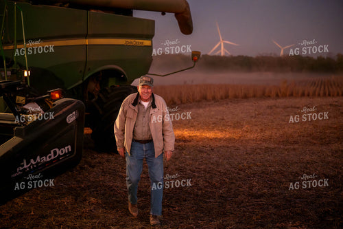 Farmer Walking by Combine 115448