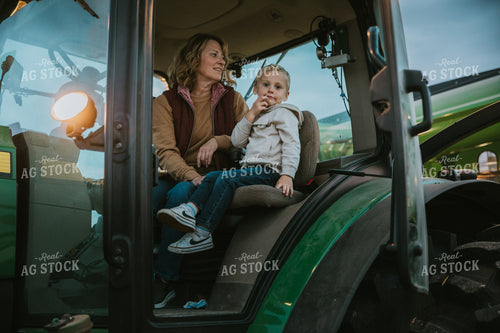 Farmer and Farm Kid in Tractor 6717
