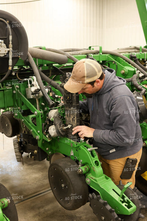 Farmer Fixing Planter 161118