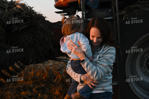 Farm Family Climbing Out of Combine 26322