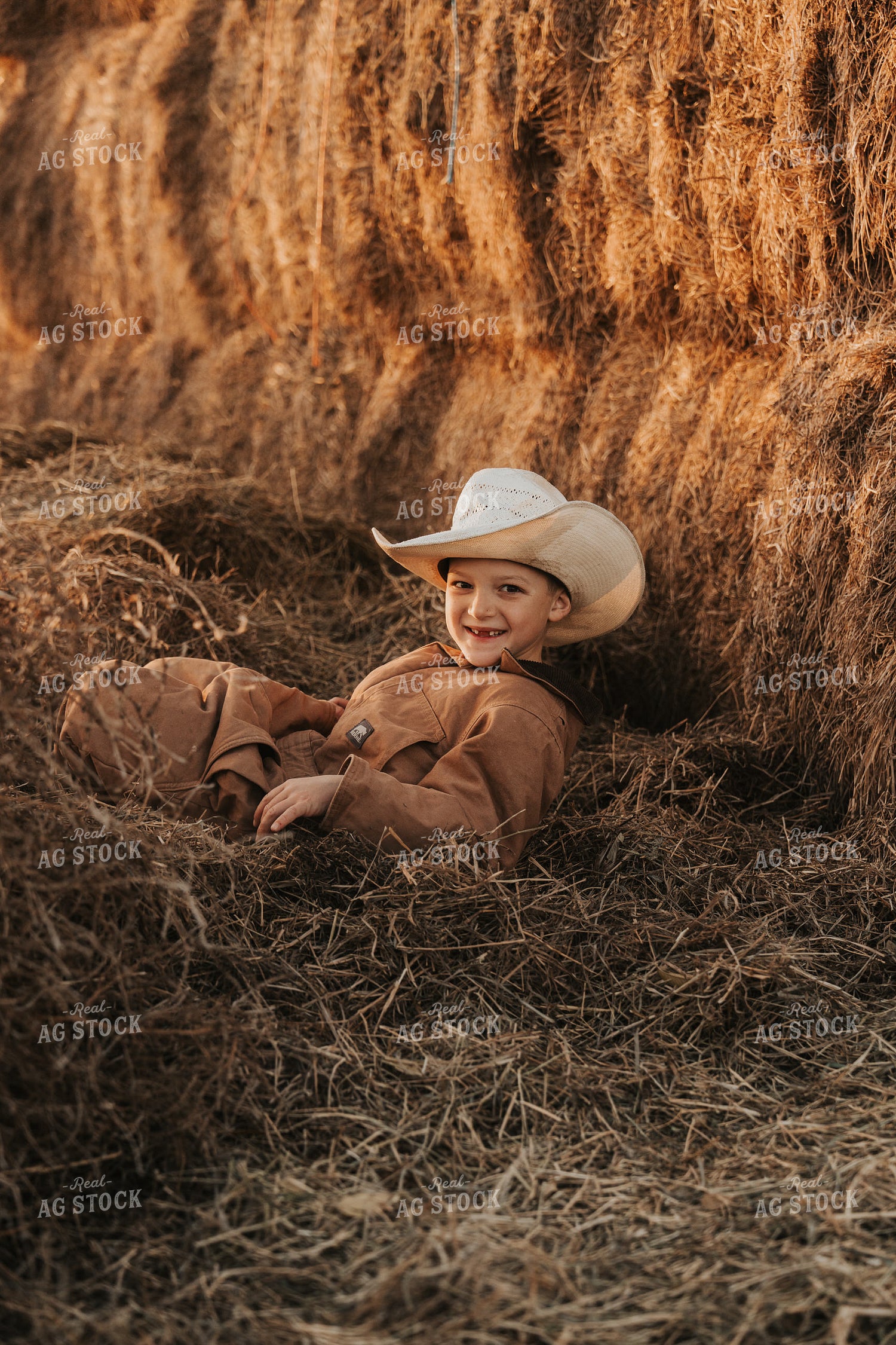 Ranch Kid Playing in Hay 61232