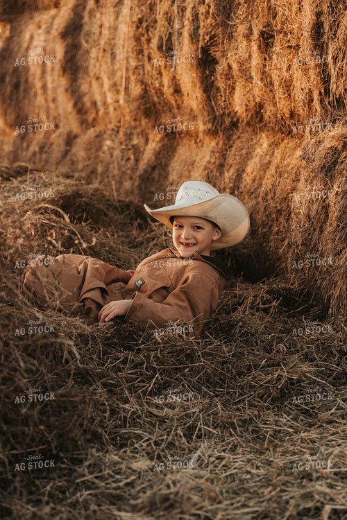 Ranch Kid Playing in Hay 61232