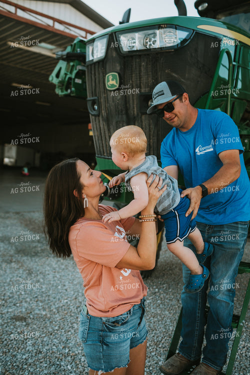 Farm Mom Helping Kids Down from Sprayer 6232