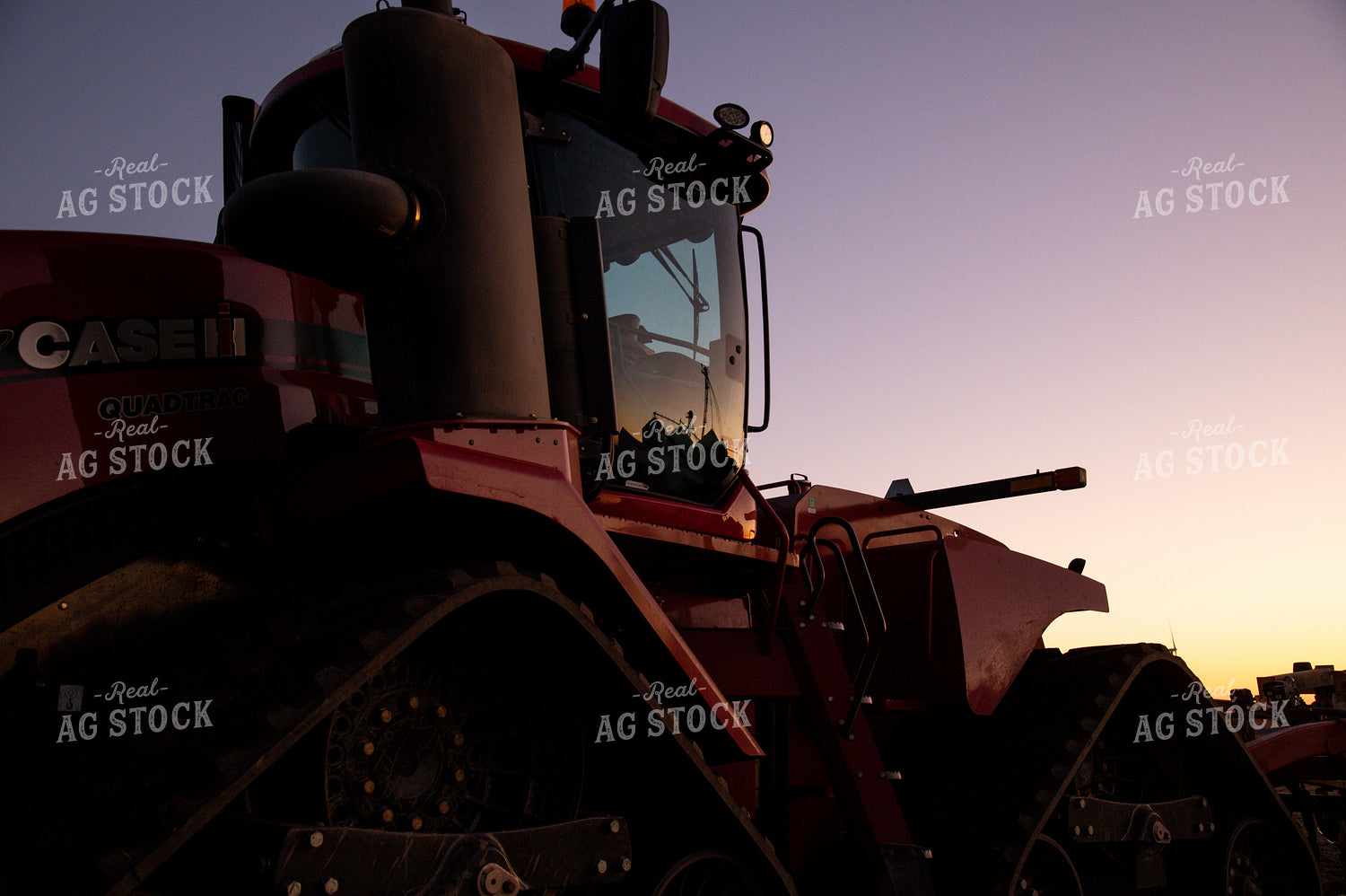 Grain Bin Reflection off Tractor Door at Sunrise 25857