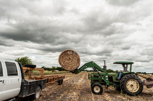 Loading Round Bale of Cornstalks 59024