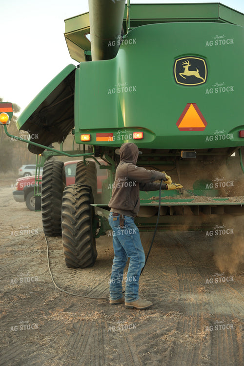 Farmer Blowing out Combine 114096