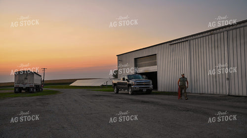 Farmer Working at Grain Bin Site during Harvest 25768