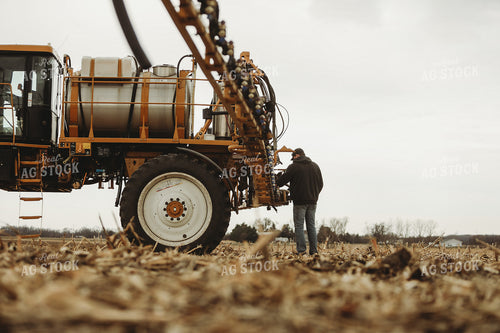 Farmer Checking Sprayer Valves 3645