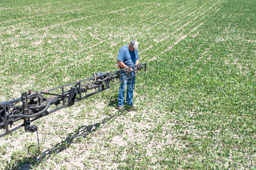 Farming Working on Sprayer Arm 103004