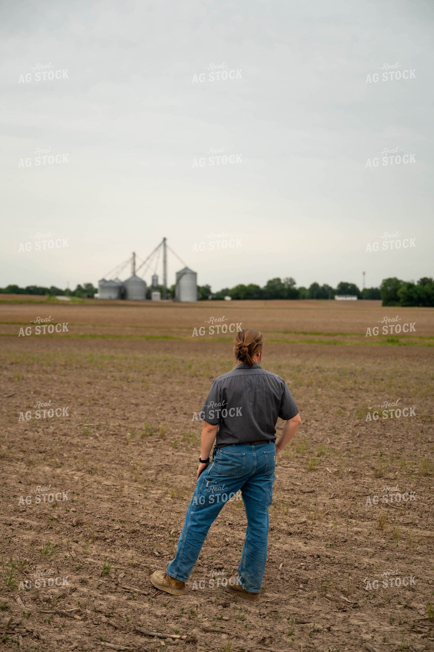 Female Farmer Walking in Field 115731