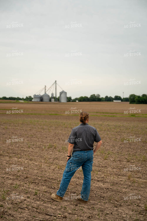 Female Farmer Walking in Field 115731