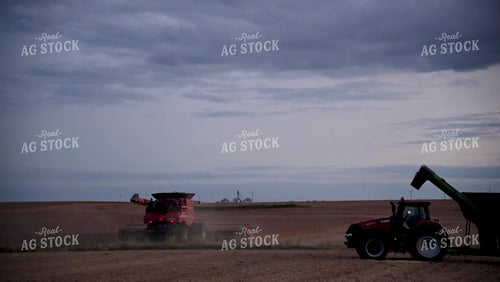 Combine Unloading Soybeans on the go into an Auger Wagon - 524